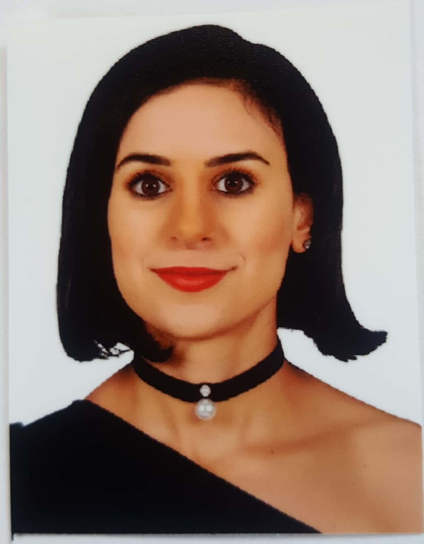 Headshot photo of Dia Hommos